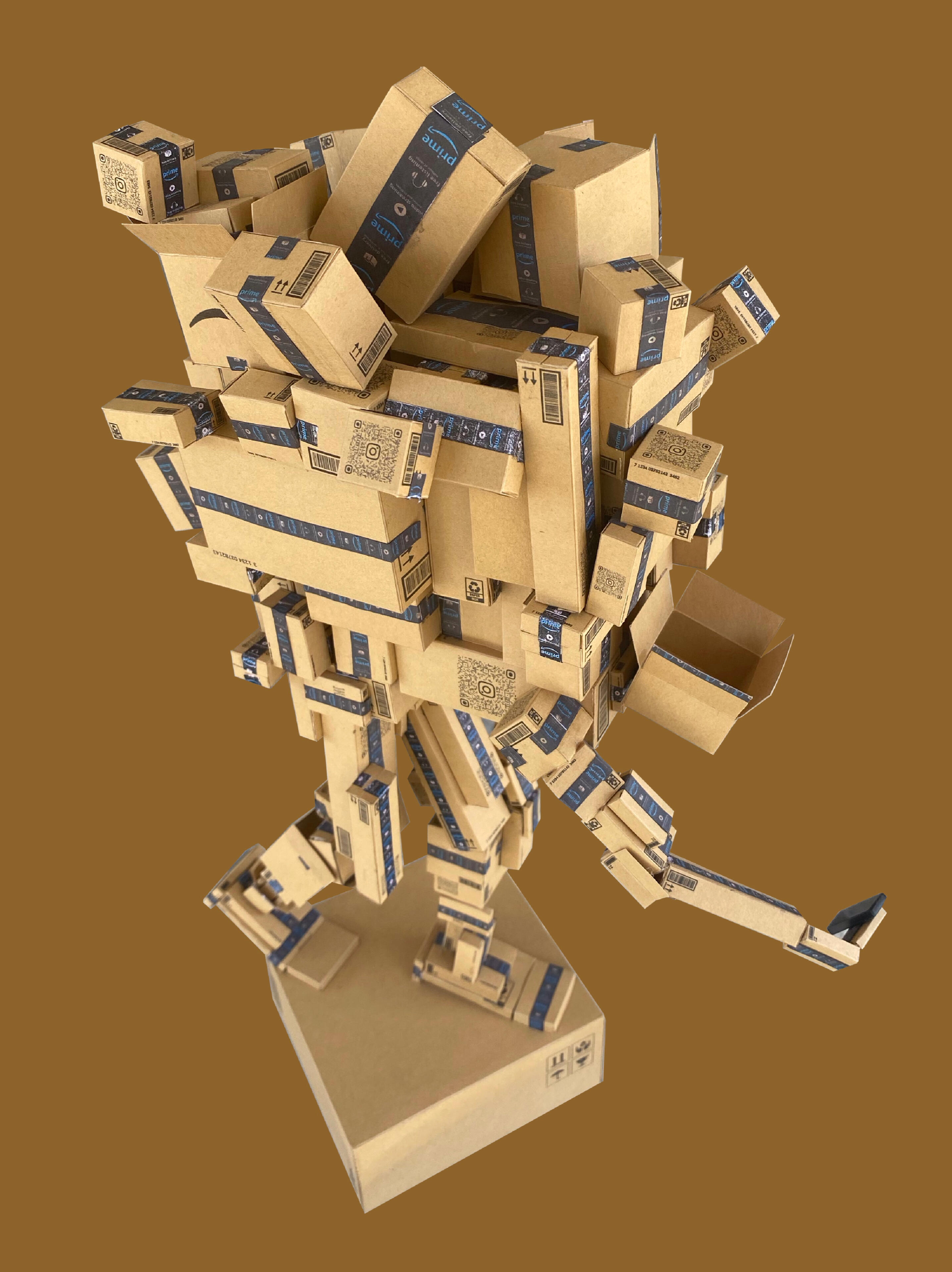 Black sculptural form resembling stacked tires on a white background.