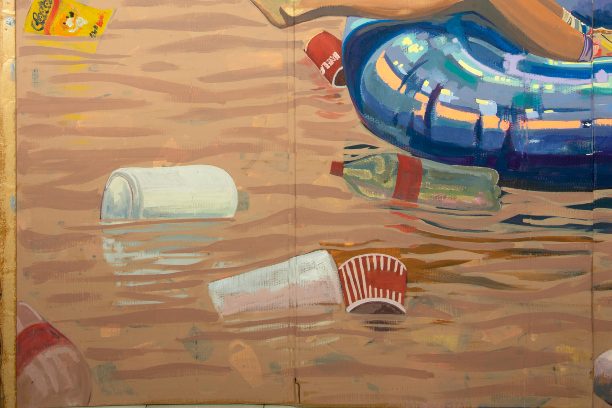 Black sculptural form resembling stacked tires on a white background.