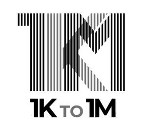 Black sculptural form resembling stacked tires on a white background.